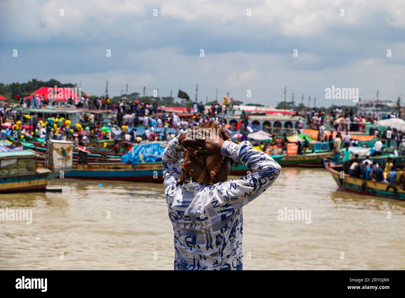 Traditional boat station, people's lifestyle, and cloudy sky photography captured on June 25, 2022, from Jajira, Bangladesh Stock Photo