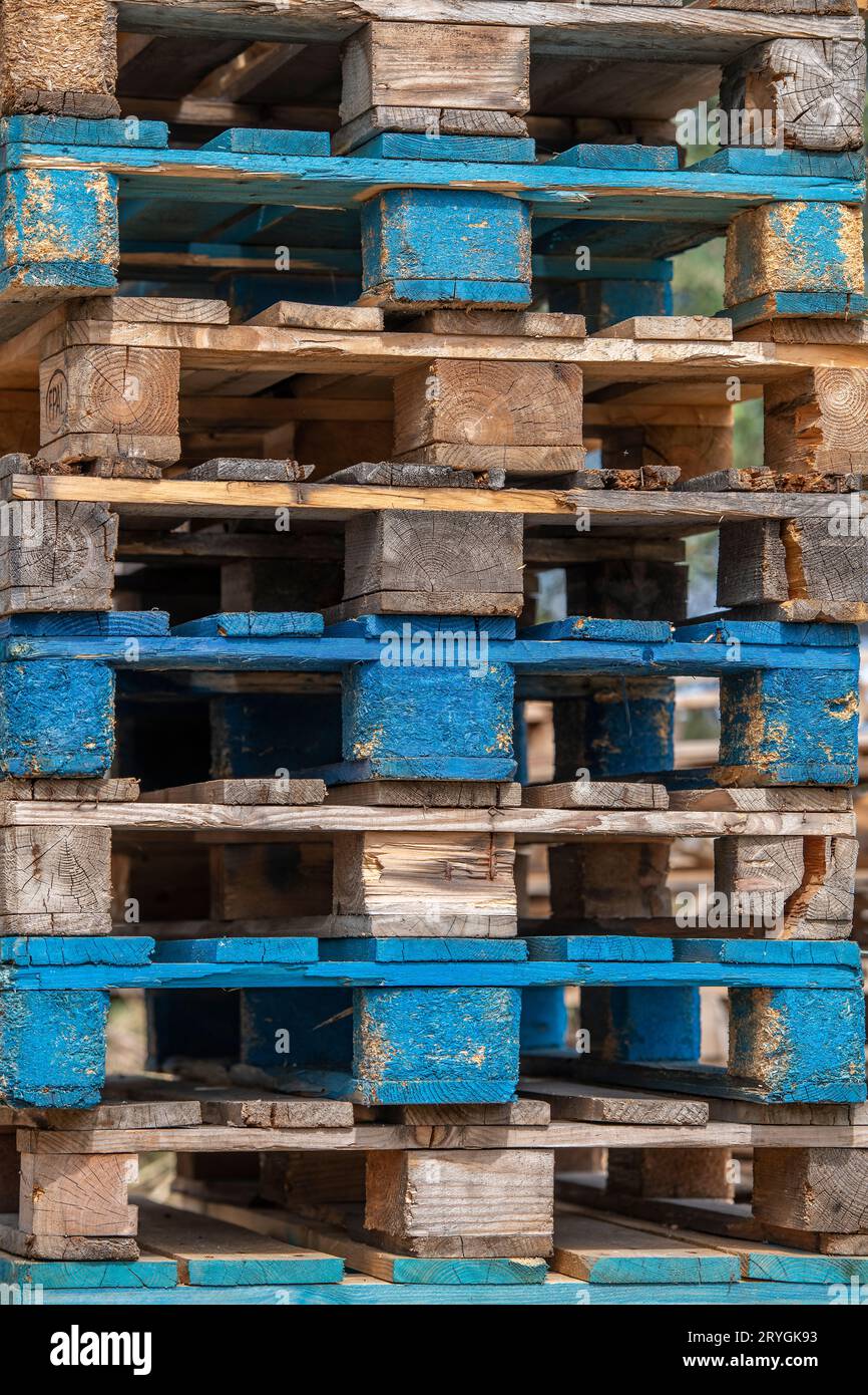 abstract view of a pile or stack of wooden forklift truck pallets. Stock Photo