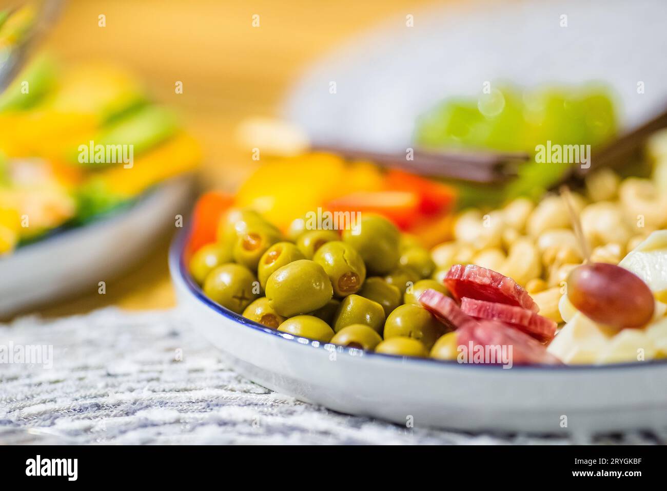 Appetizers plate with different snacks, cheese, olives, fruits and nuts Stock Photo Alamy