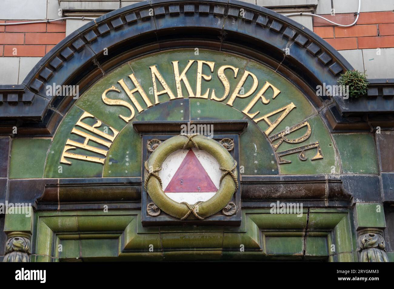 Looking up at The Shakespeare - a closed pub with notable facade of Kitching and Lee tiles, on Linthorpe Road, Middlesbrough, UK Stock Photo