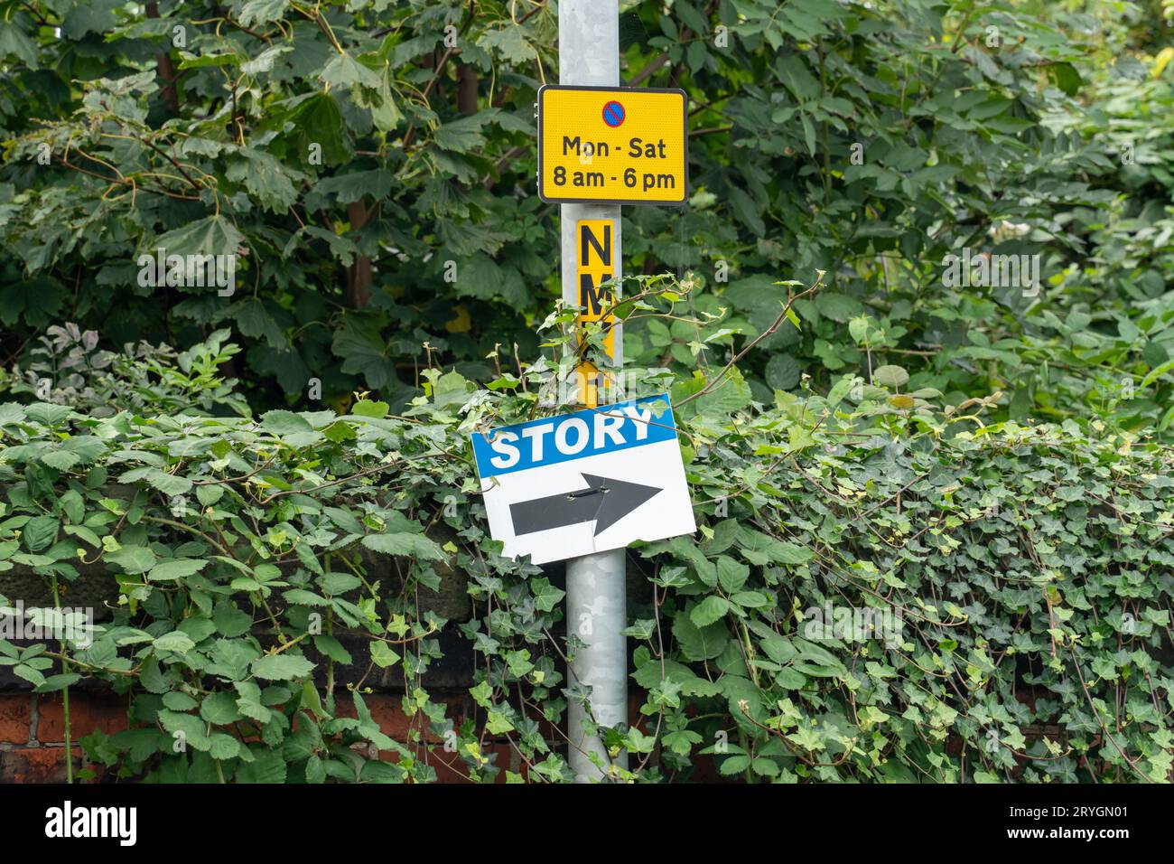 A sign on a lamp post indicates direction for deliveries to Story -  construction and infrastructure company, in Middlesbrough, UK Stock Photo