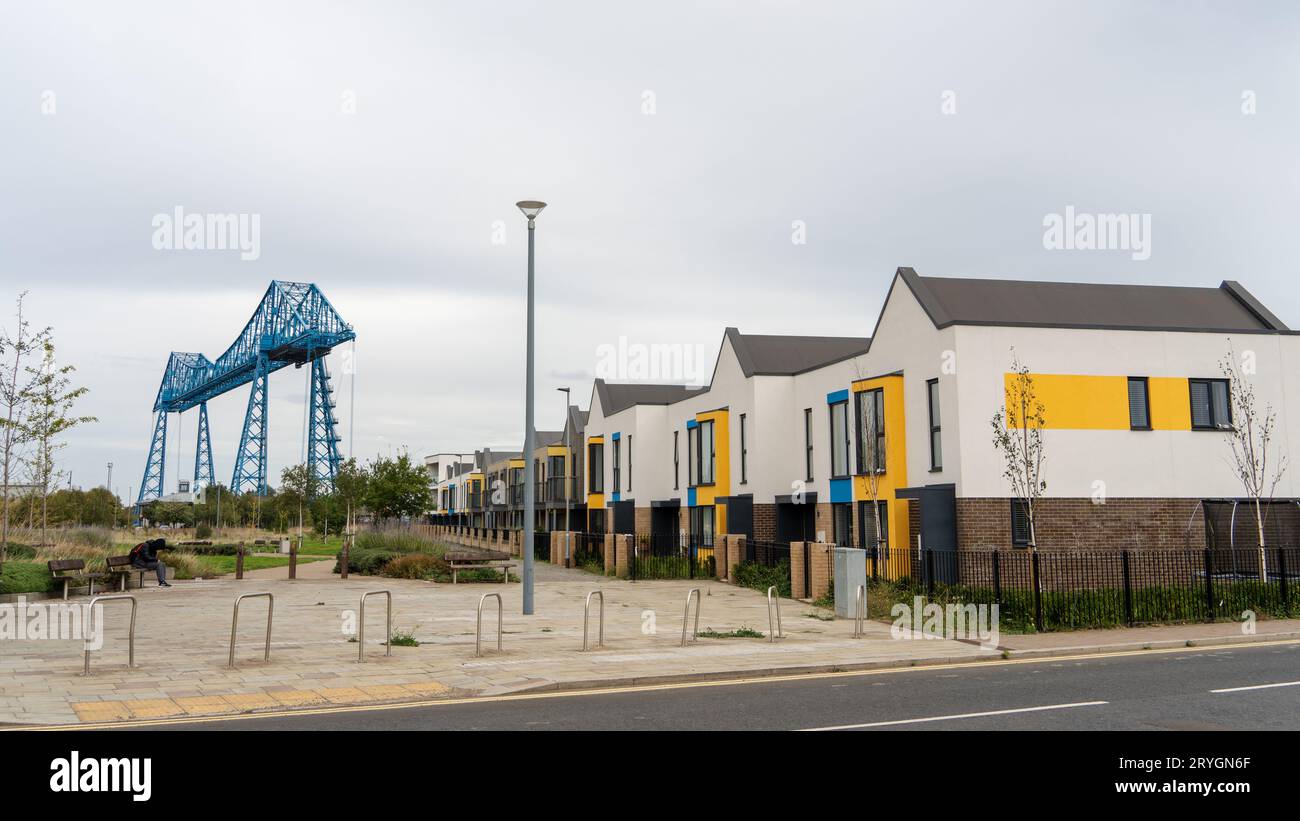 Tees Transporter Bridge and Boho area housing development, as seen from Lower East Street in the town of Middlesbrough, UK Stock Photo