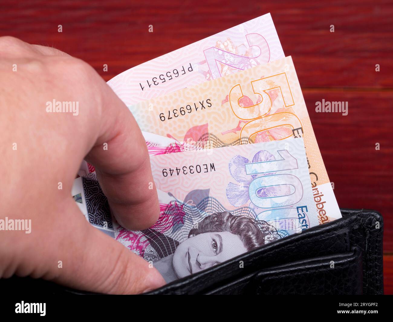 Eastern Caribbean dollar in the black wallet Stock Photo - Alamy