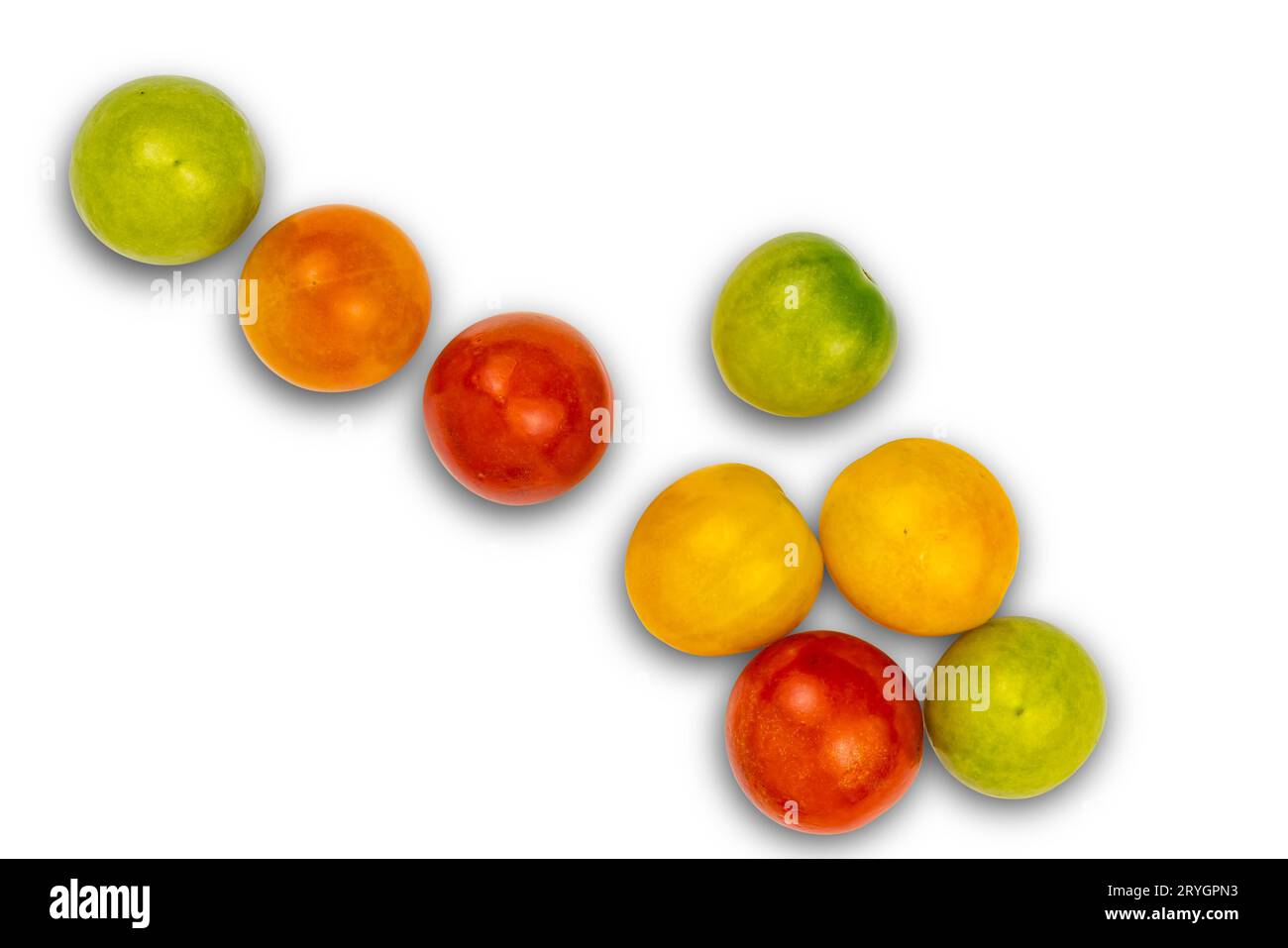 Multi colored cherry tomatoes on white background. Stock Photo
