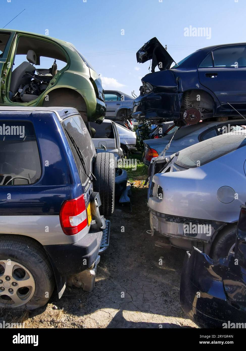 Car junkyard outdoor with wreck of a destroyed cars. Environmental
