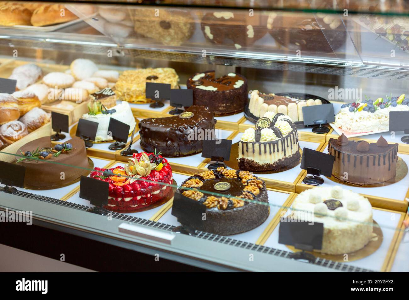 Showcase with sweets. Cakes, pastries, biscuits Stock Photo Alamy