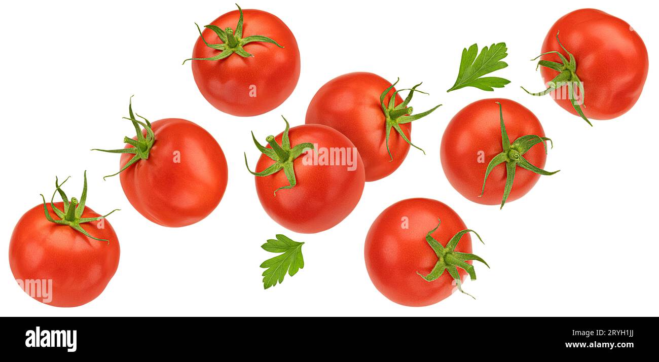 Falling cherry tomatoes isolated on white background Stock Photo