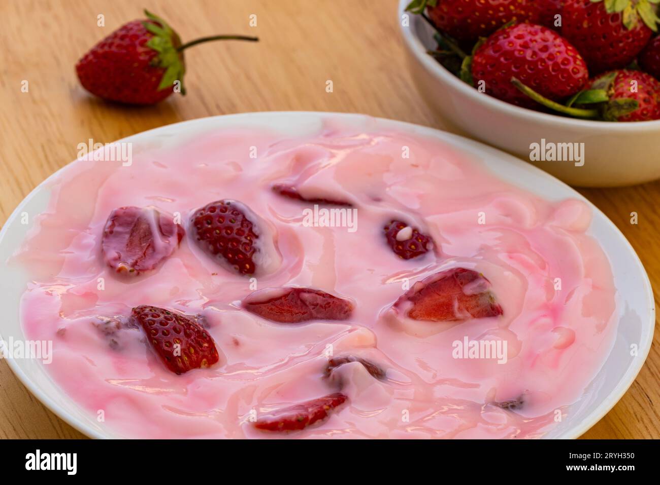 Strawberry pieces in yogurt hires stock photography and images Alamy