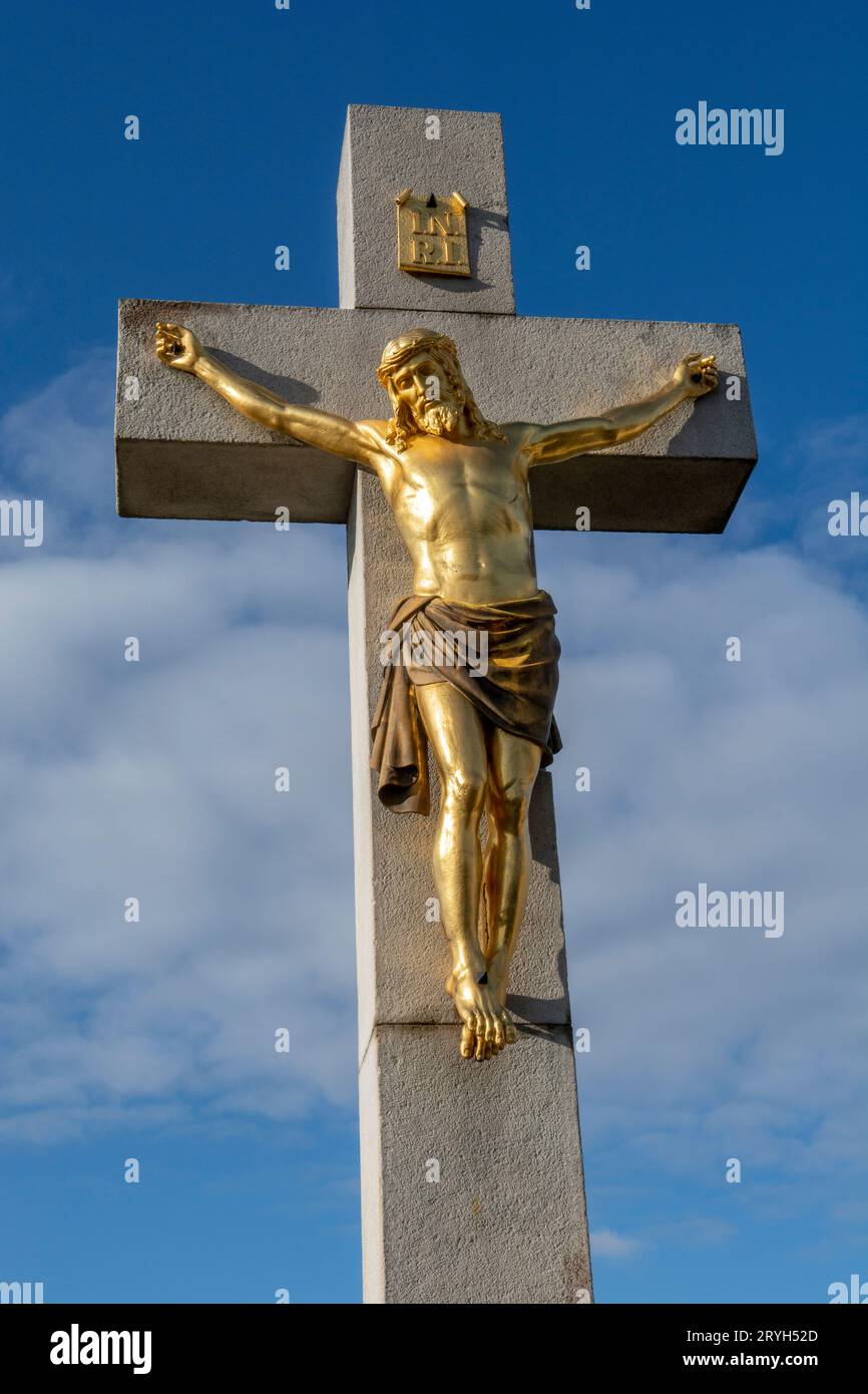Golden crucified Jesus Christ on the cross. Close up. Detail. Nitra Calvary. Slovakia. Stock Photo