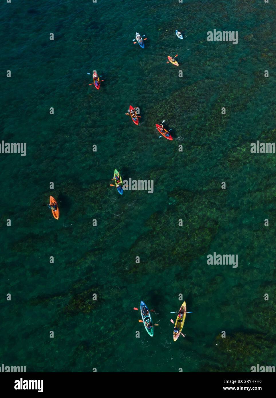 Group of athlets kayaking in the sea. People active Stock Photo