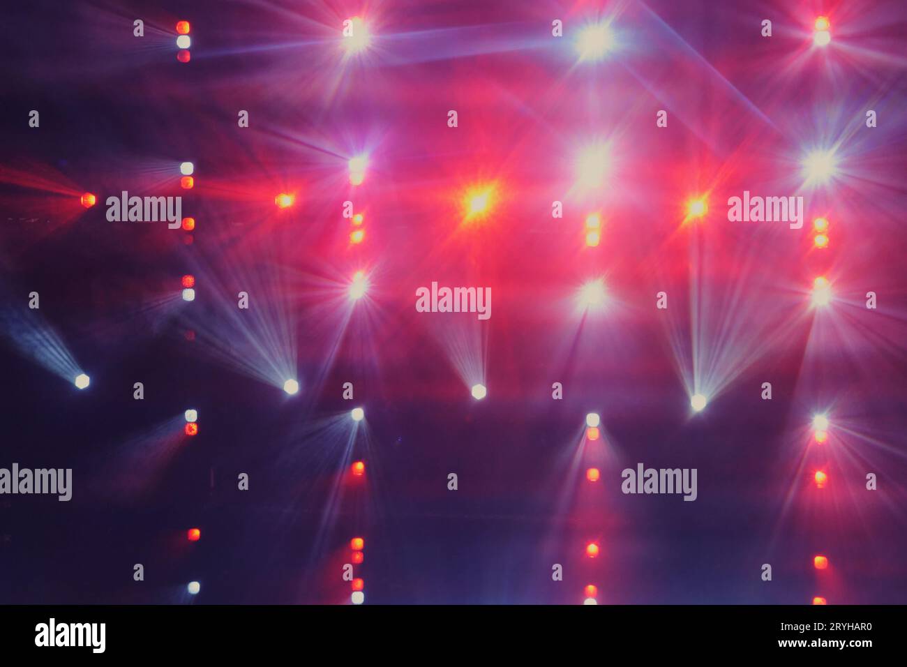 Color stage lighting effect in the dark with red and blue rays of light