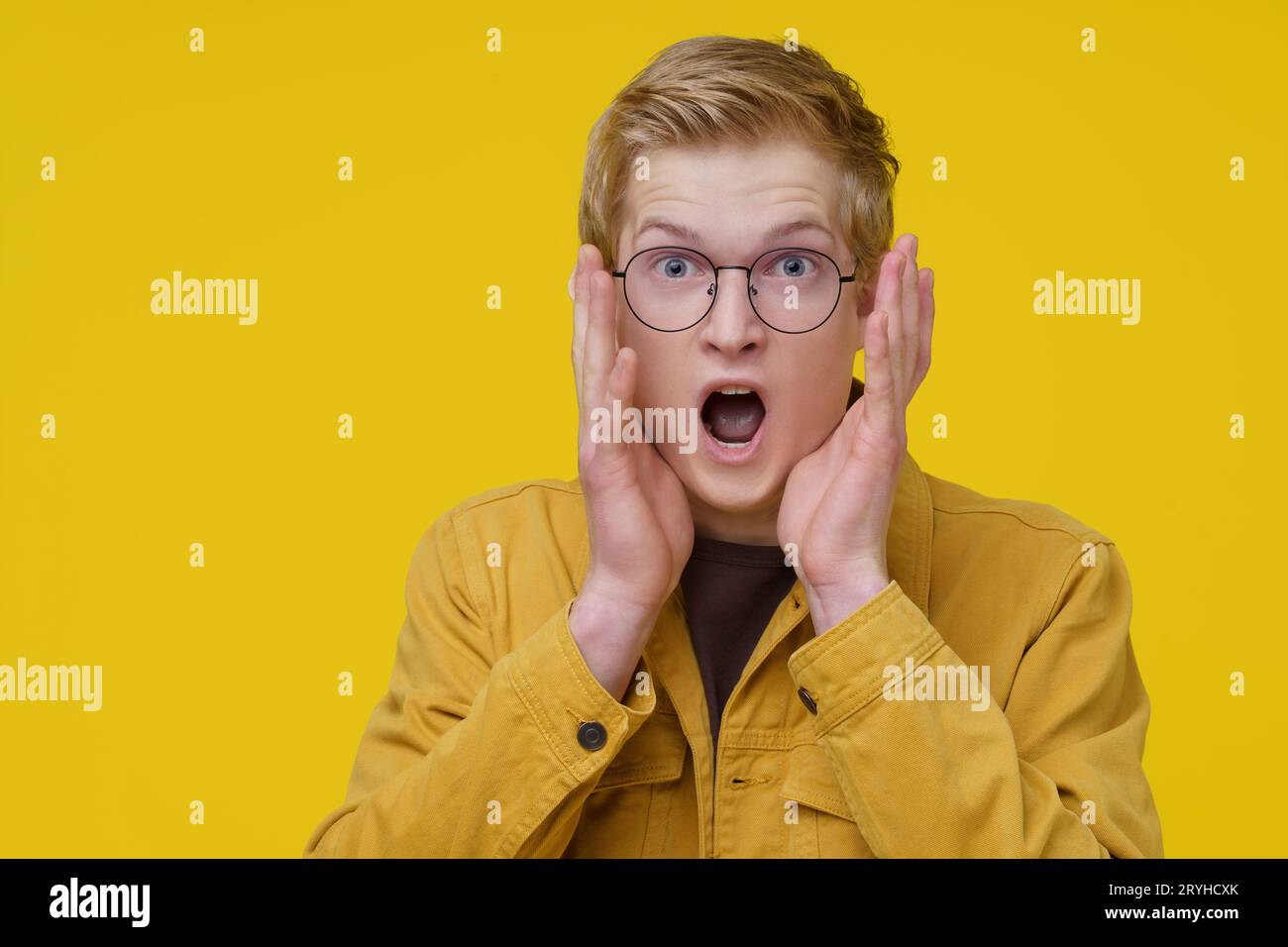 Scary Movie Concept. A Young European Actor Demonstrates a scene from a Cult Movie. Stock Photo