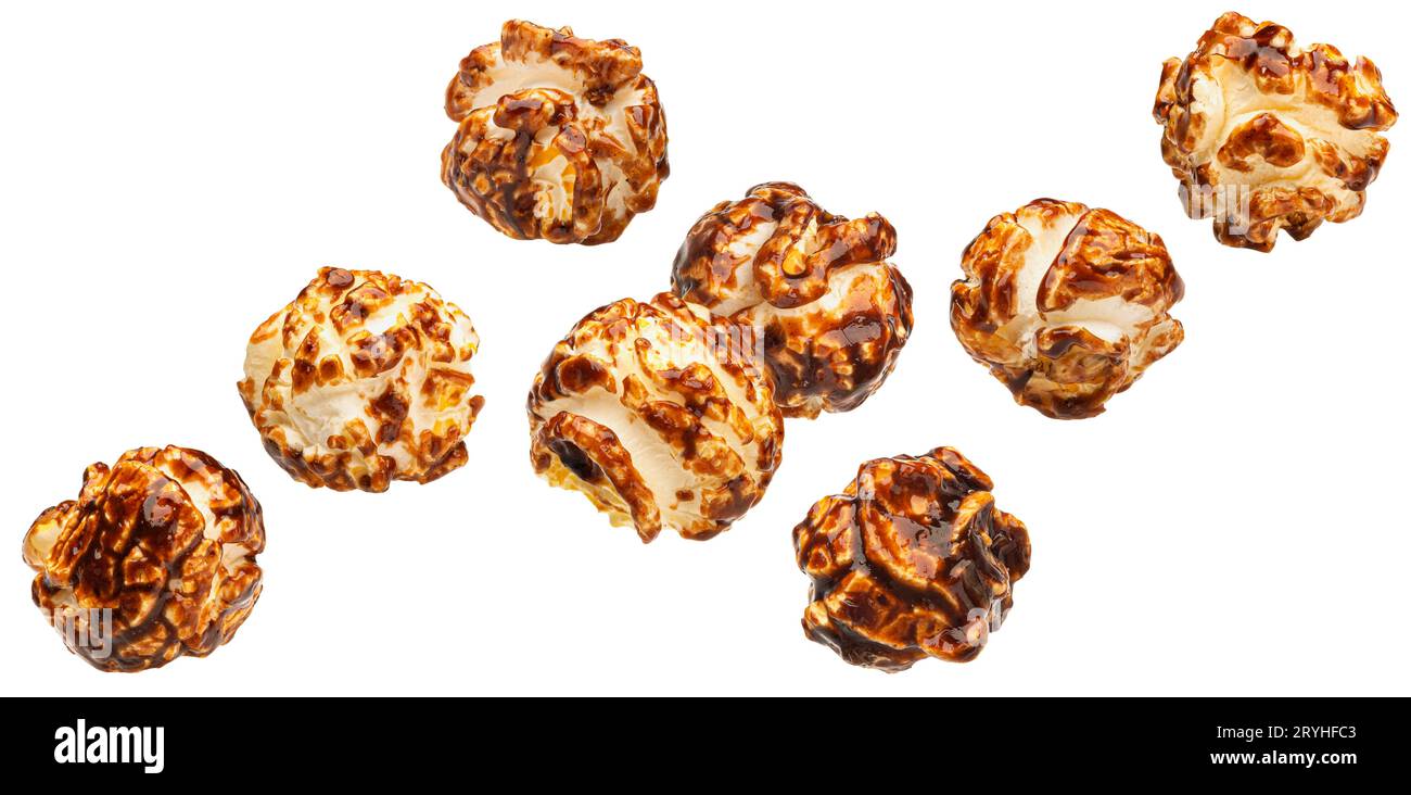 Falling caramel popcorn isolated on white background Stock Photo