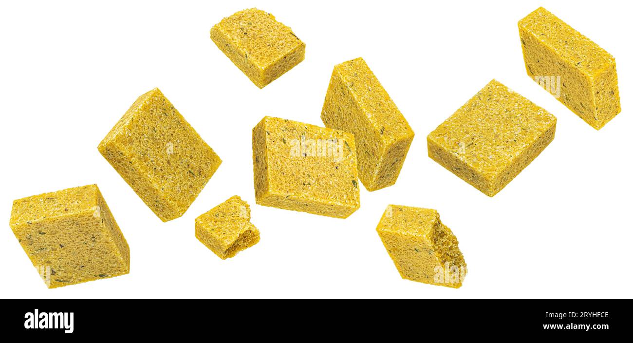 Falling bouillon cubes isolated on white background, chicken broth