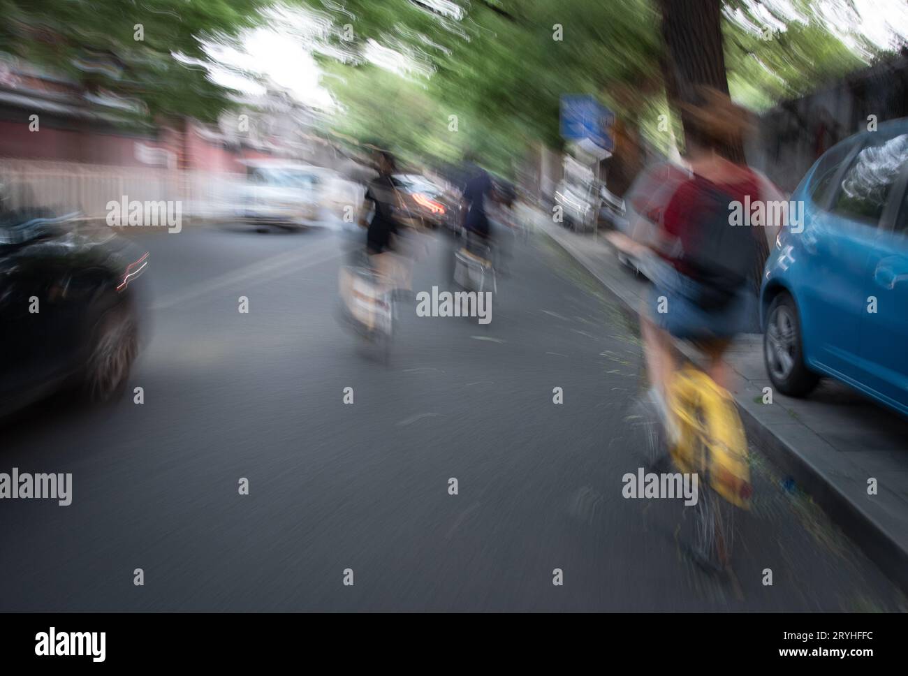 People riding a bicycle and moving in the city. Eco friendly transportation. Healthy living Stock Photo