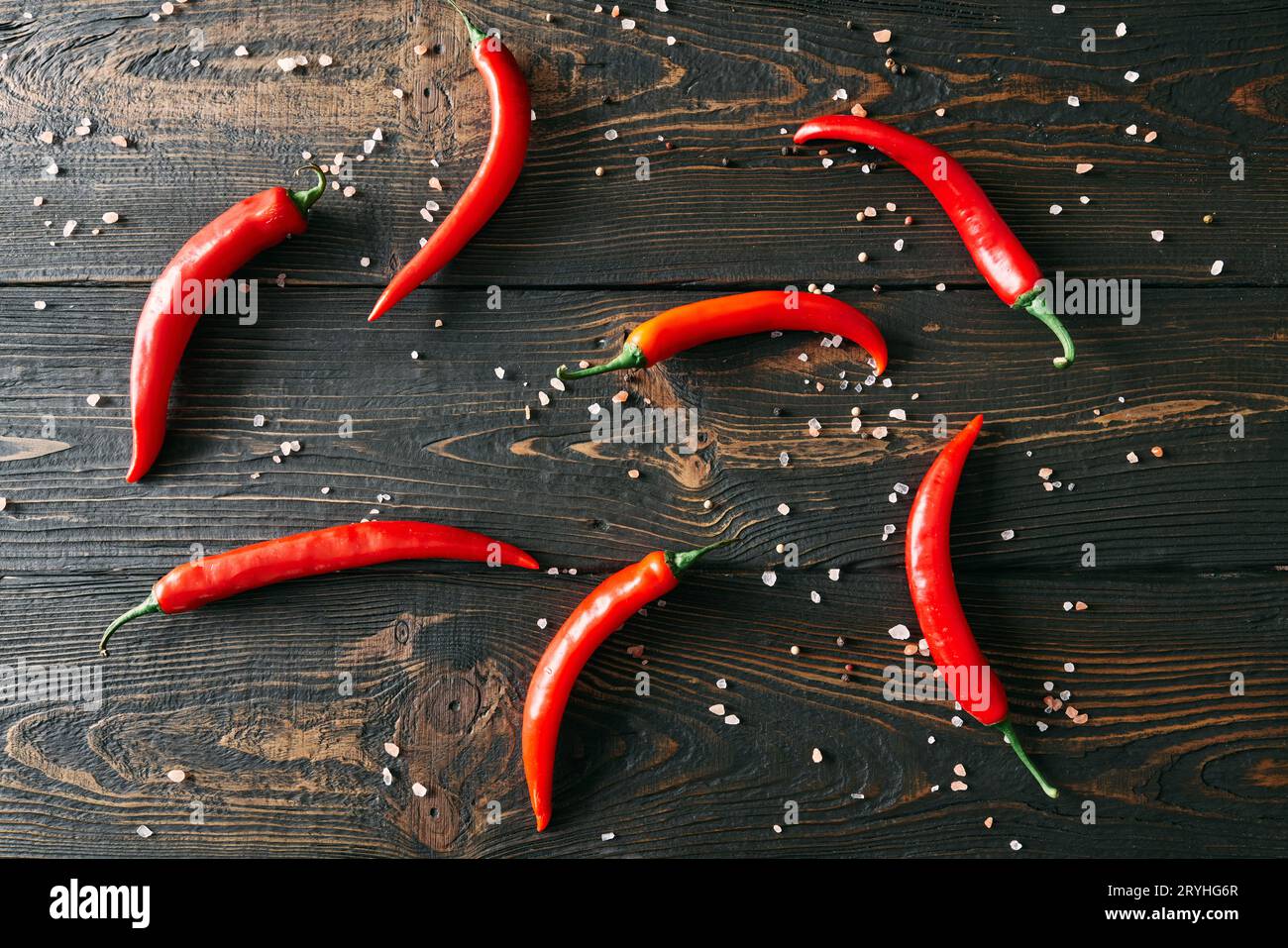 Red hot chili peppeprs on dark wooden background Stock Photo - Alamy