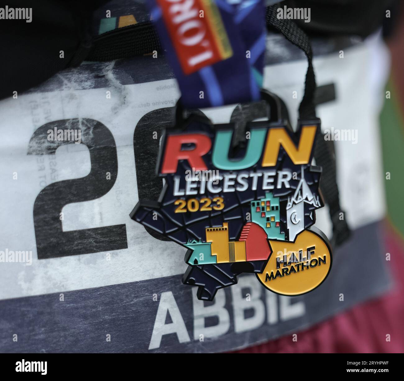 Runners in the Leicester Half Marathon 2023 going through the finish