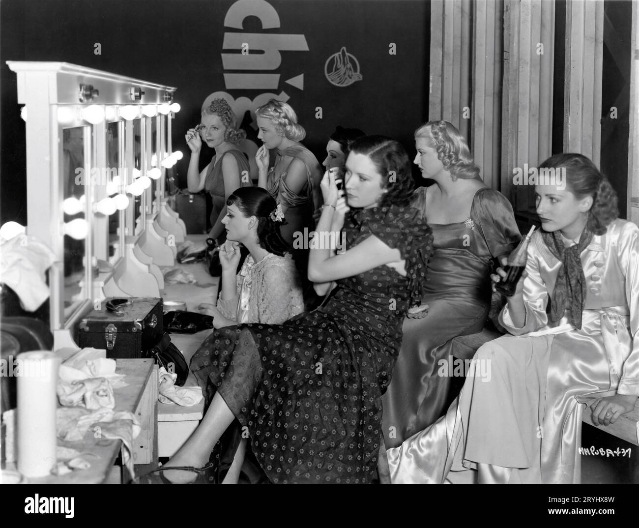Chorus Girls fixing their makeup on set candid during filming of