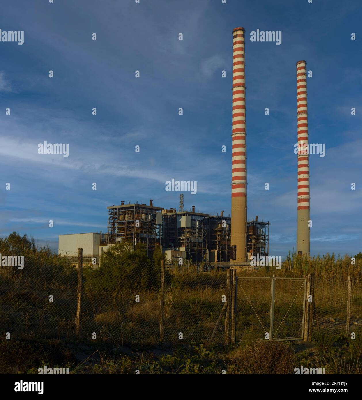 The ENEL thermoelectric power plant of Torre del Sale with its two tall  chimneys, Tuscany, Italy Stock Photo - Alamy