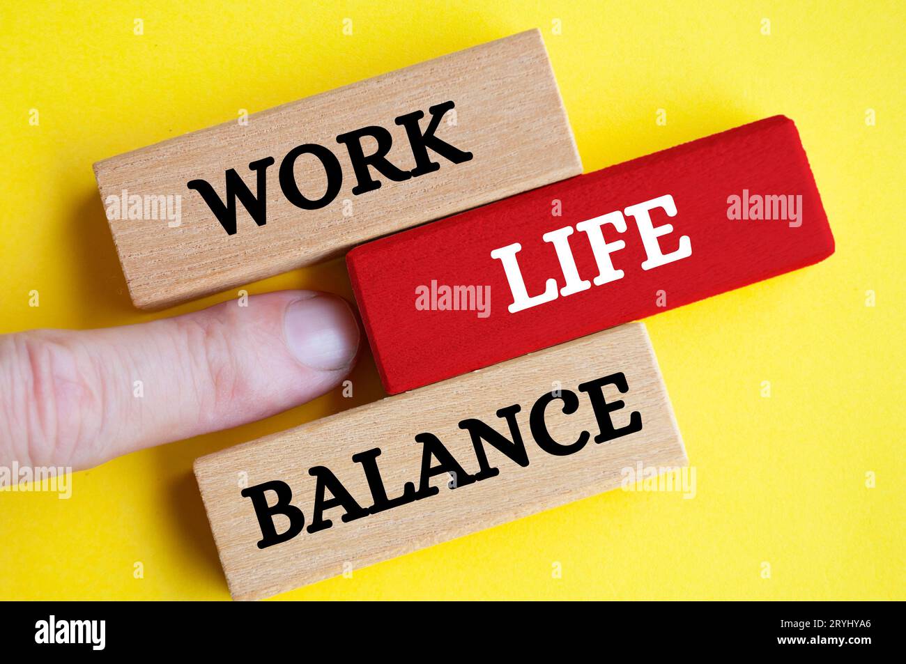 Work life balance text on wooden blocks with yellow cover background ...