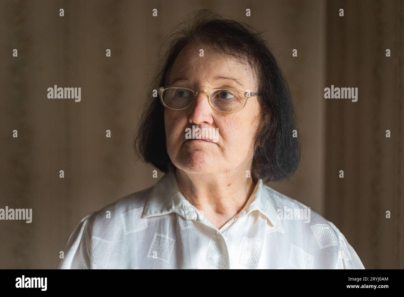 Portrait of an elderly woman with eyeglasses. Vision problems Stock Photo