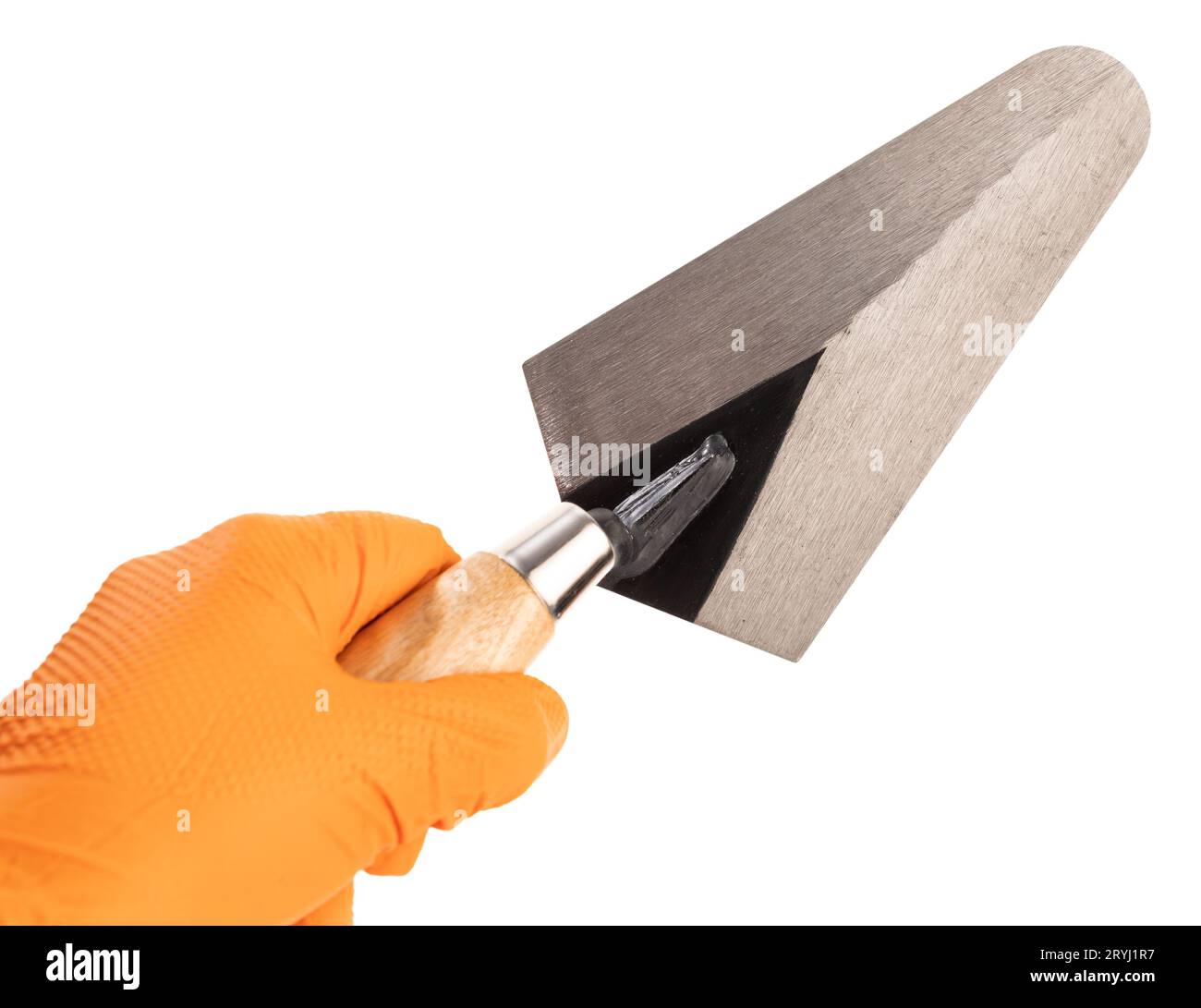 Hand Holding a Trowel isolated on White Background. Construction industry. Copy space Stock Photo