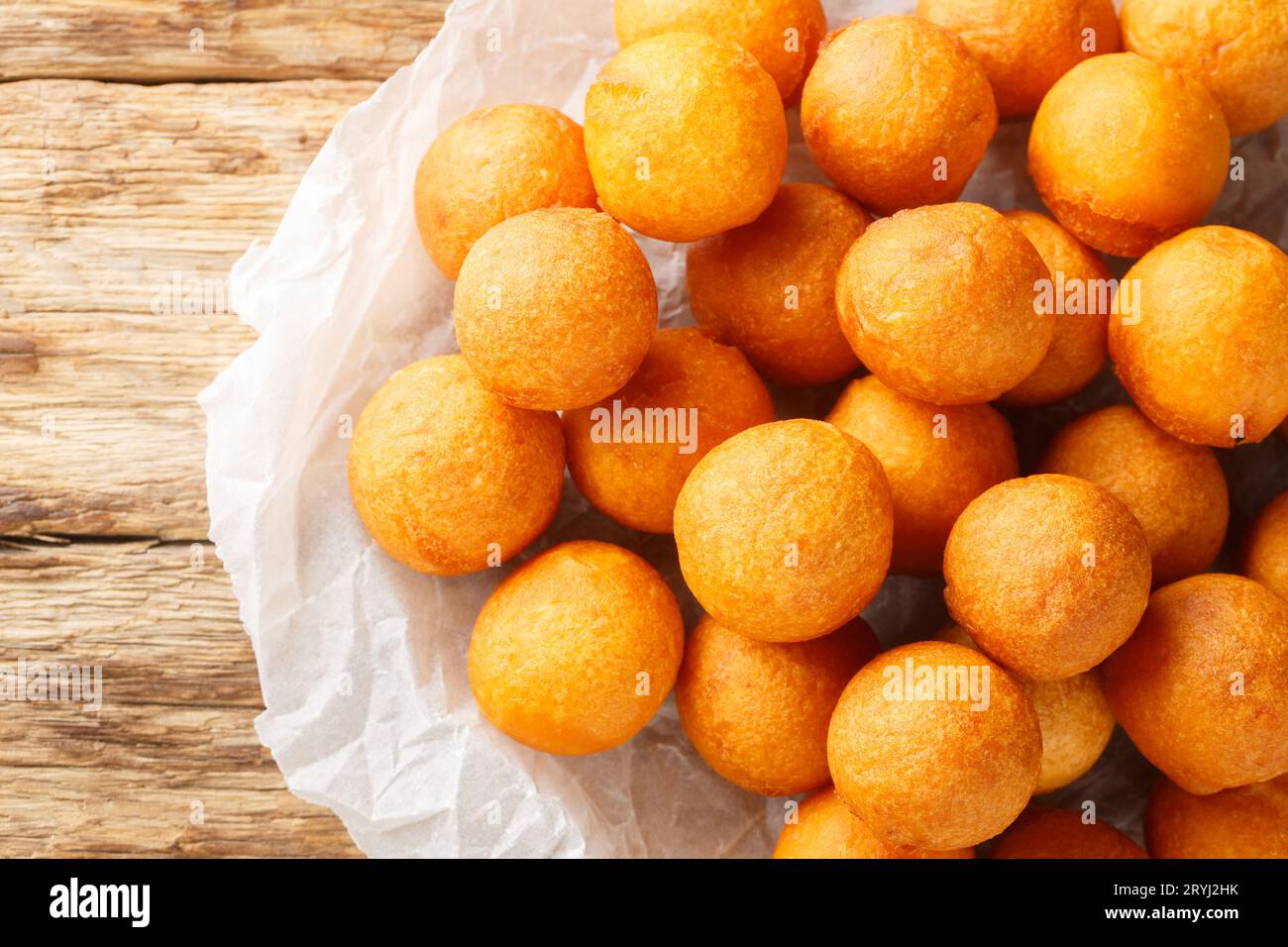 Fried sweet potato balls are a common Thai street sweet made