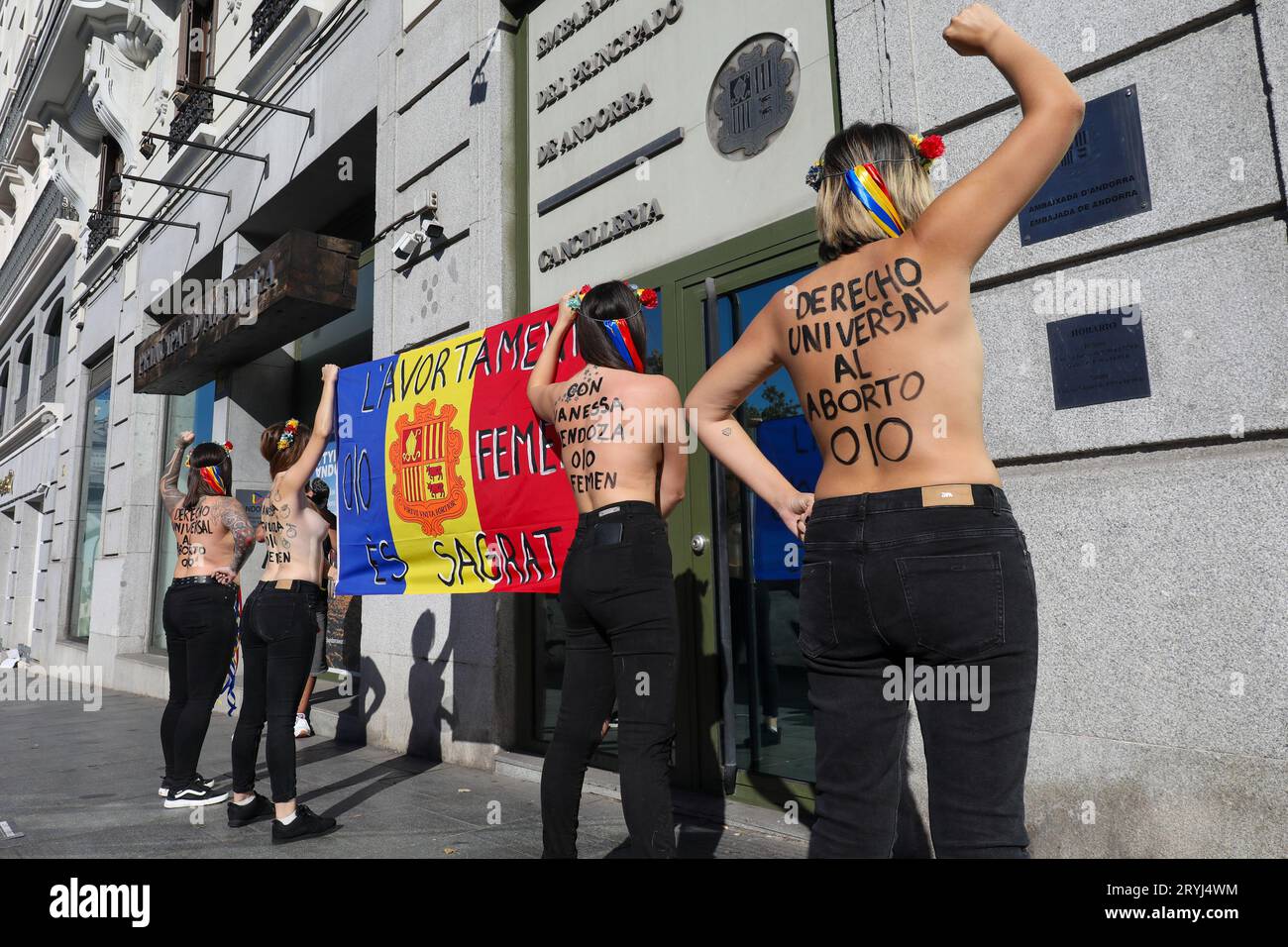 Madrid, Spain. 01st Oct, 2023. A group of Femen activists stand in front of the Andorran embassy with a flag of the principality during the demonstration. Femen España activists protested in front of the Andorran Embassy in Madrid in support of the pro-feminism activist Vanessa Mendoza, president of the Andorran organization 'Stop Violences', who faced a trial for defending the right to board in the Principality where abortion is prohibited in all cases. Credit: SOPA Images Limited/Alamy Live News Stock Photo