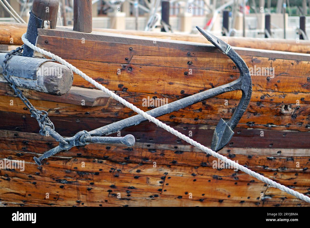 Iron anchor at ancient ship traditional wooden dhow in Kuwait port