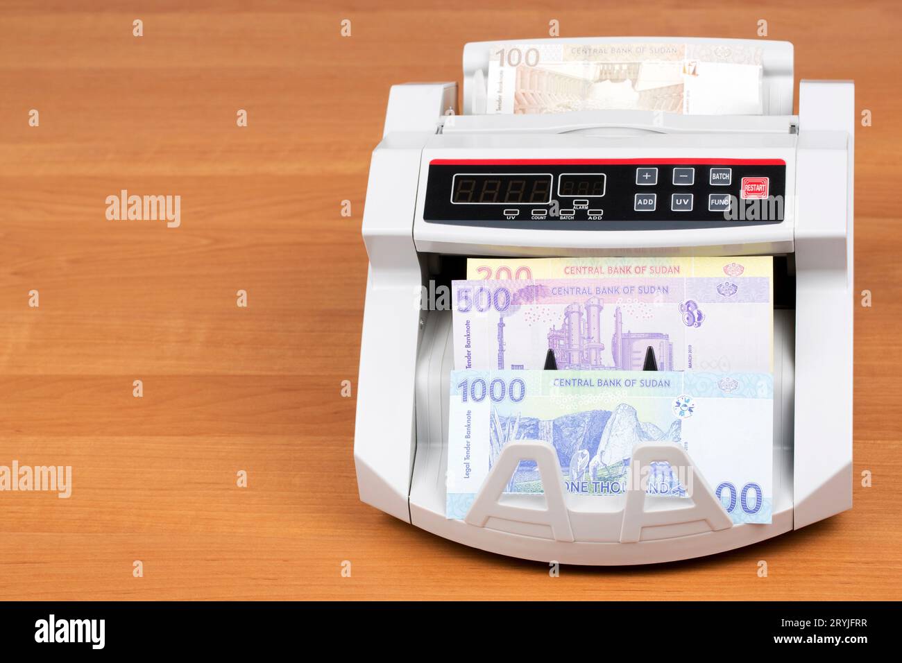 Sudanese money in a counting machine Stock Photo