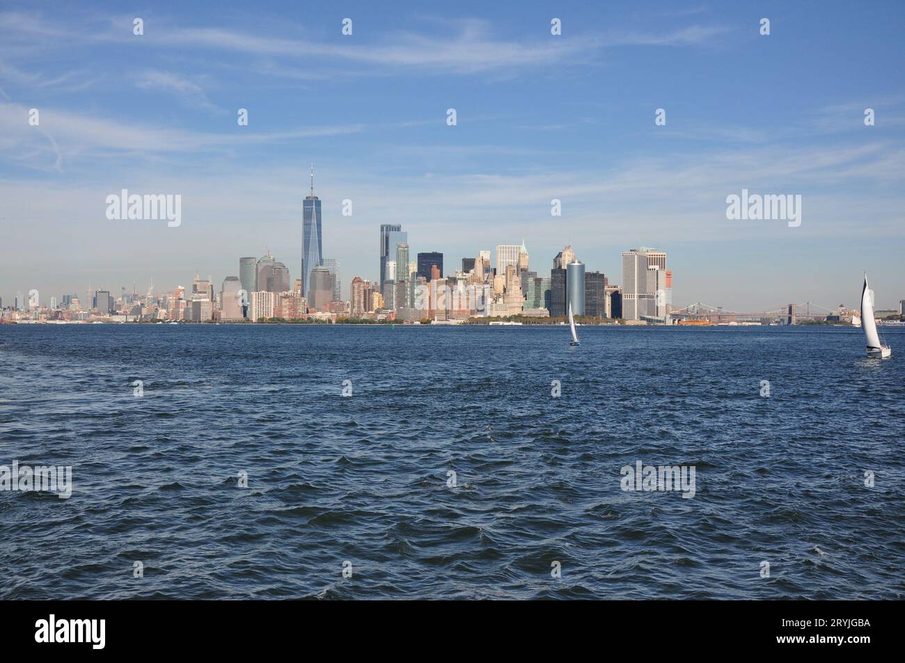 Beautiful shot of Manhattan skyscrapers against blue ocean in New York
