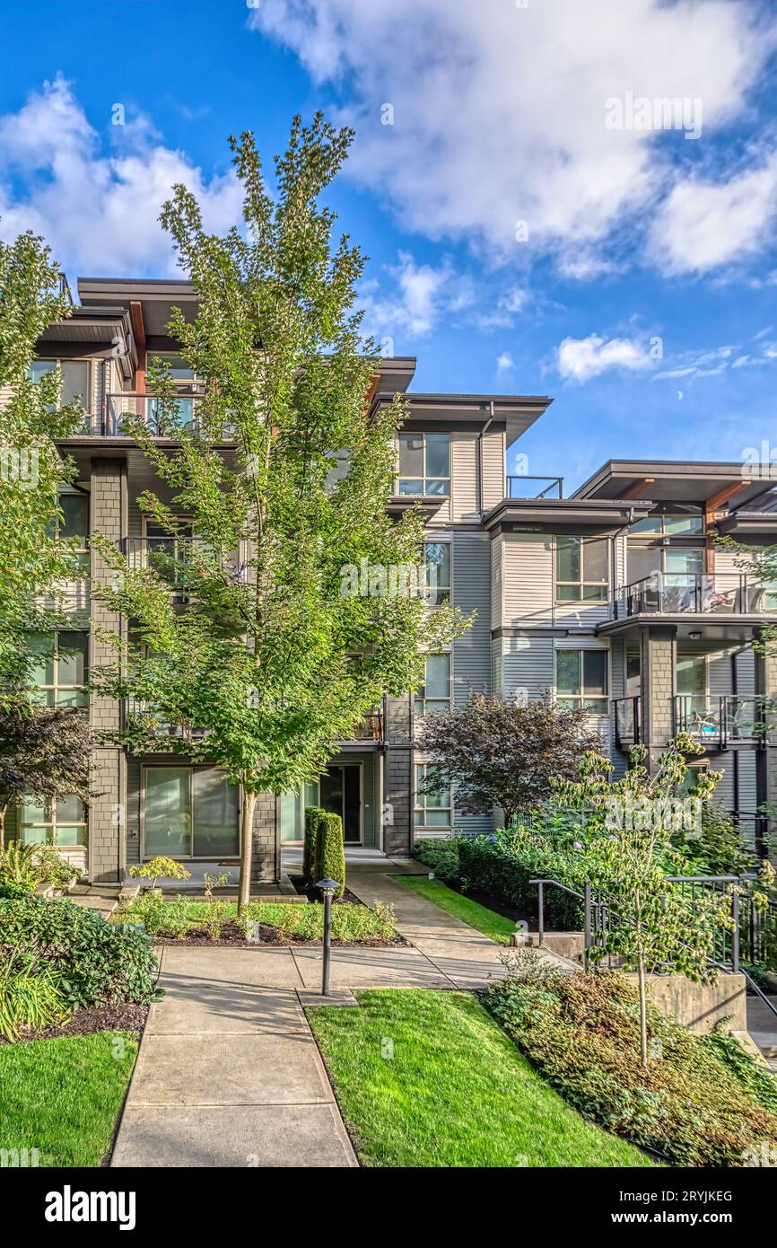 Residential apartment building on blue sky background Stock Photo - Alamy