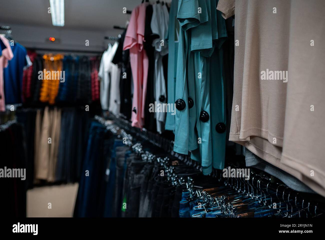 T-shirts and jeans in a clothing store. Stock Photo