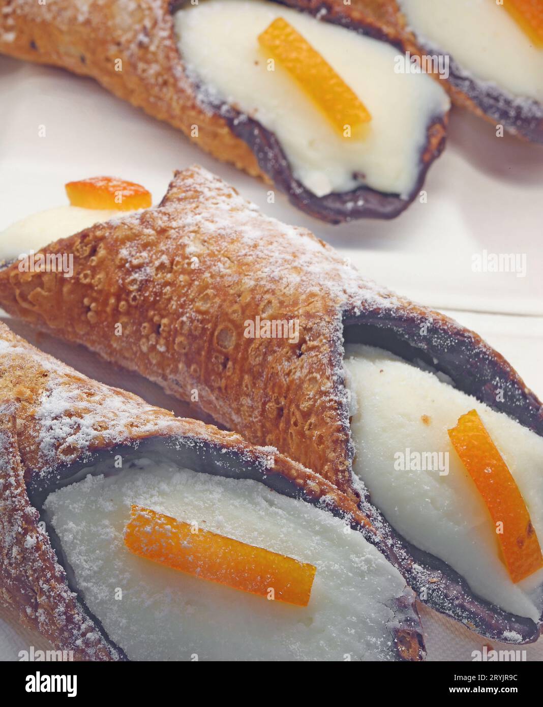 Sicilian cannoli made with sheep s cheese and a strip of candied orange peel typical dessert of Italy Stock Photo