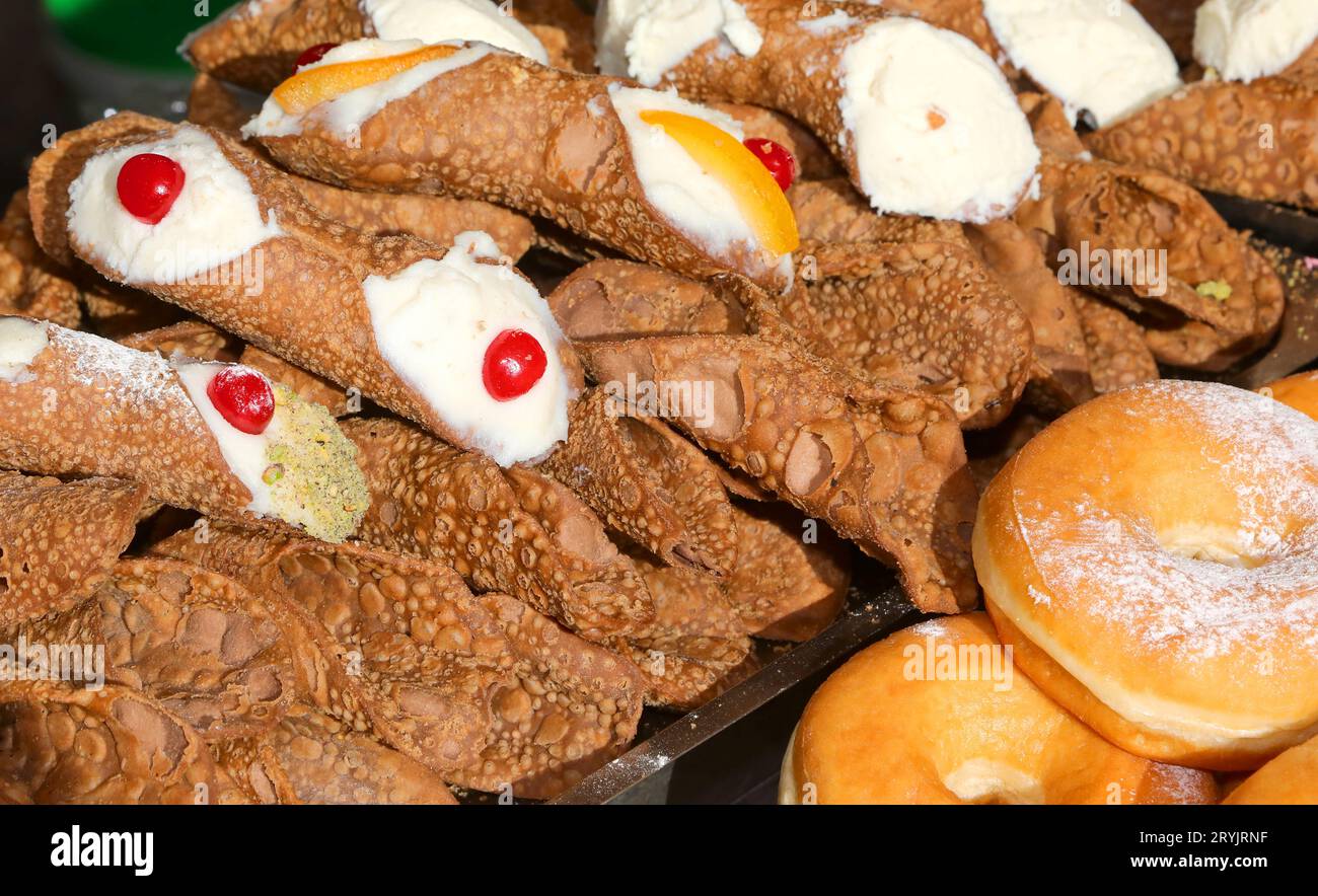 Krapfen and Italian dessert typical of Sicily Region in Italy called CANNOLO SICILIANO for sale Stock Photo