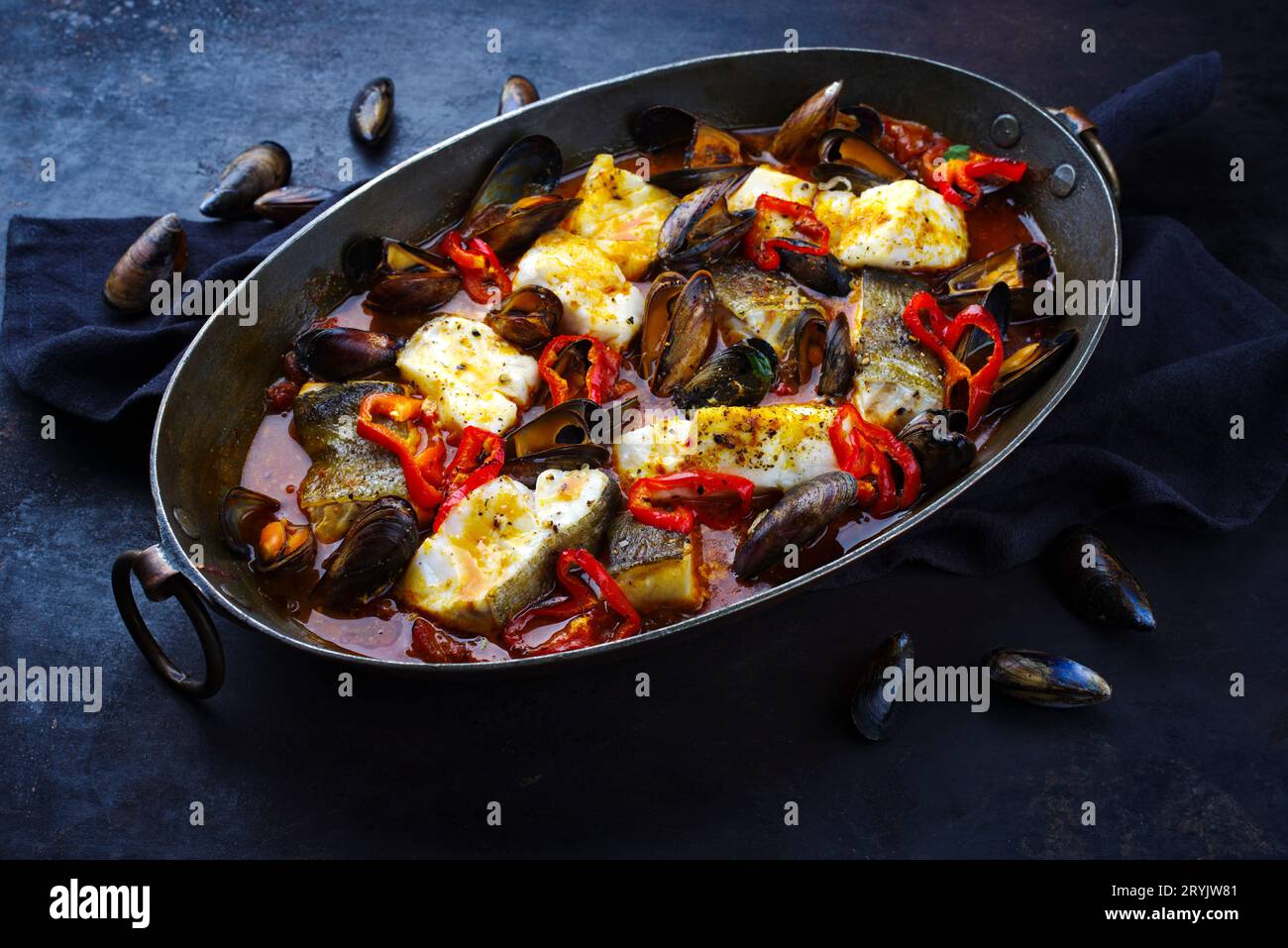French Style Cod Fish Traditional French seafood bouillabaisse with cod fish and mussels in ...
