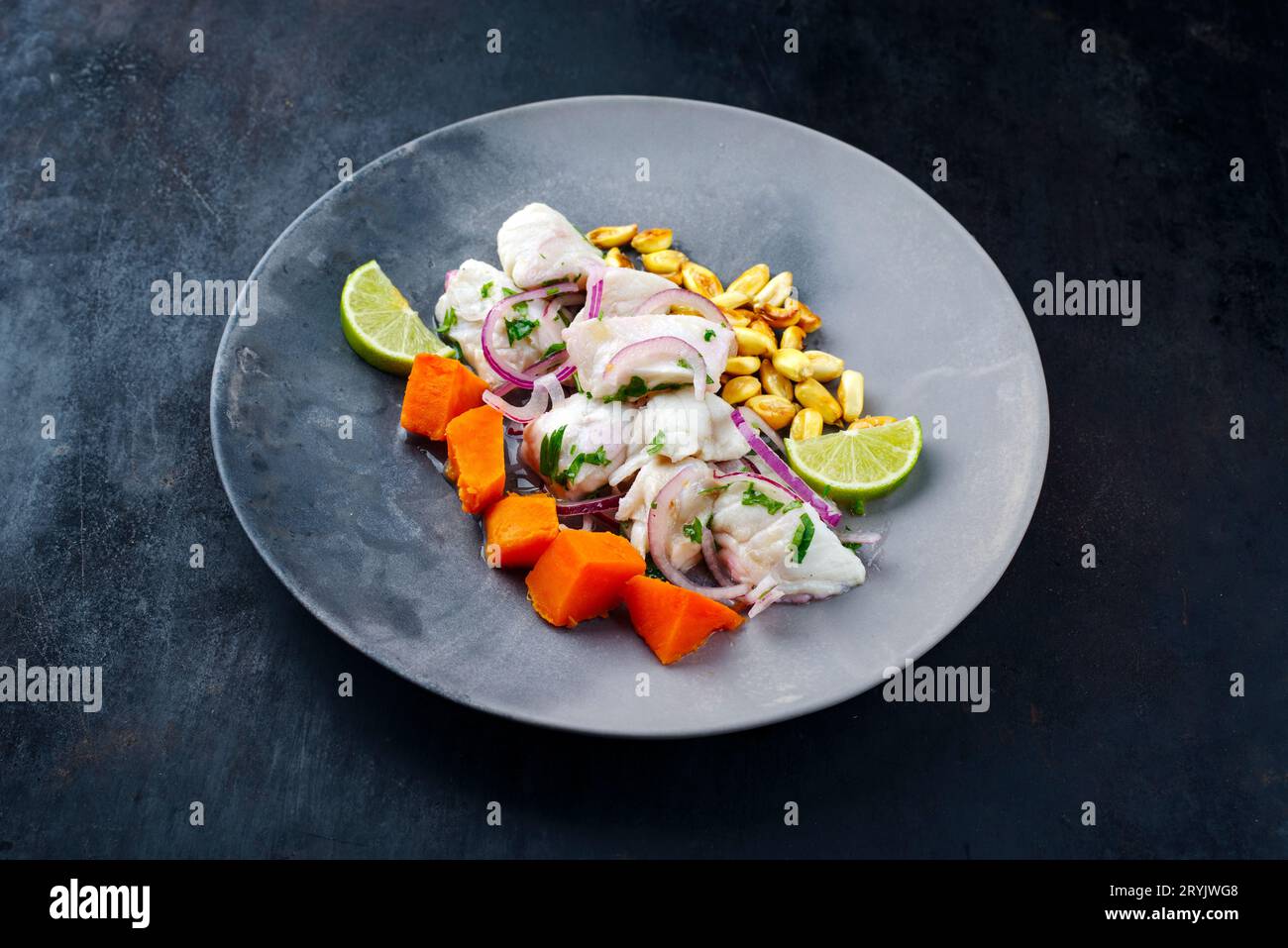 Traditional Peruvian gourmet ceviche sea bass filet piece with sweet