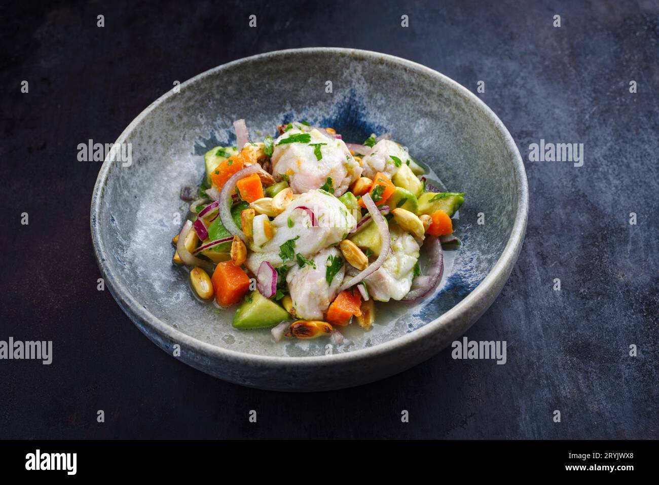 Traditional Peruvian gourmet ceviche sea bass filet piece with sweet