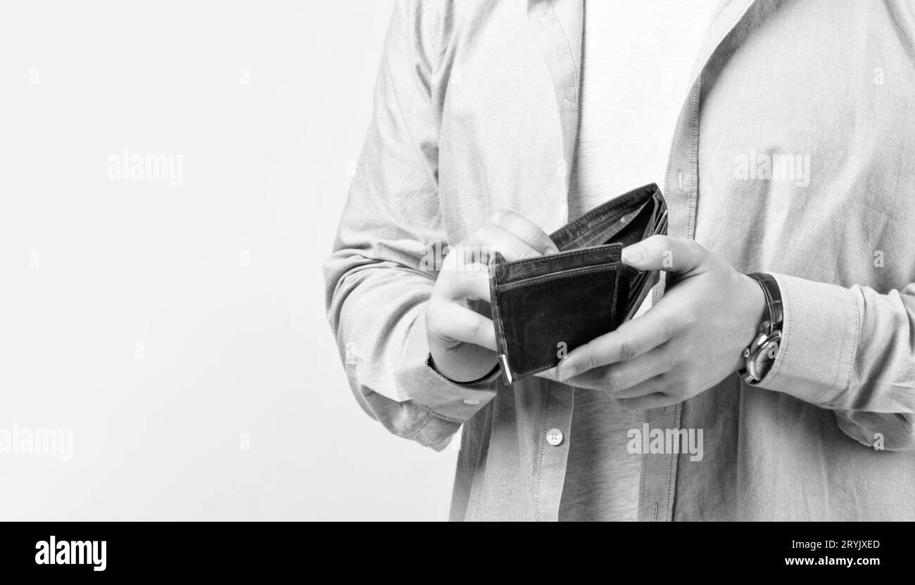closeup of broke man with wallet isolated on studio background. broke man with wallet Stock Photo