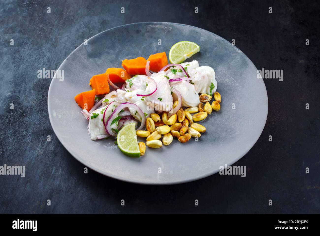 Traditional Peruvian gourmet ceviche sea bass filet piece with sweet