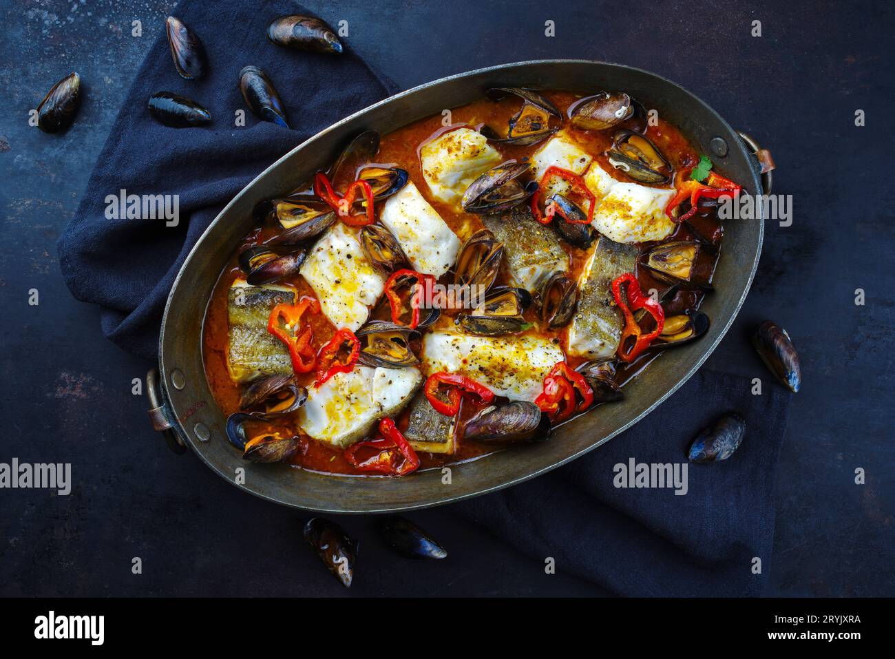 French Style Cod Fish Traditional French seafood bouillabaisse with cod fish and mussels in ...
