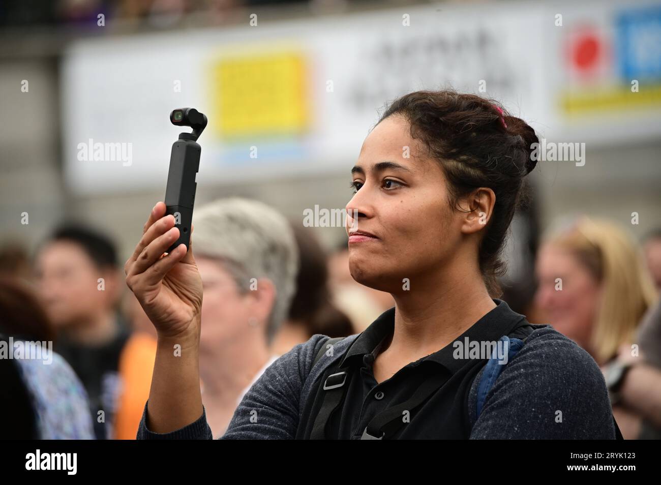 London, UK. 1st Oct, 2023. A lady using a DJI Pocket 2 Handheld Camera filming at the Japan Matsuri Festival is back in Trafalgar Square, London, UK, for Japanese culture, dances, performances, foods, and drinks. Credit: See Li/Picture Capital/Alamy Live News Stock Photo
