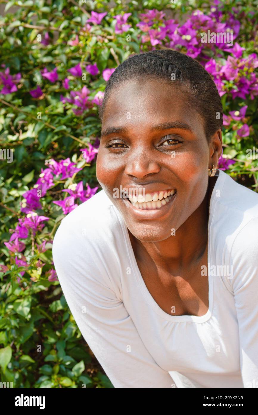 portrait of a young woman african american woman with braids, she is ...