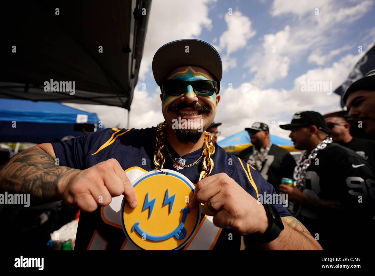 Fans for the Los Angeles Chargers and the Las Vegas Raiders tailgate in  front of SoFi stadium before an NFL football game, Monday, Oct. 4, 2021, in  Inglewood, Calif. (AP Photo/Marcio Jose