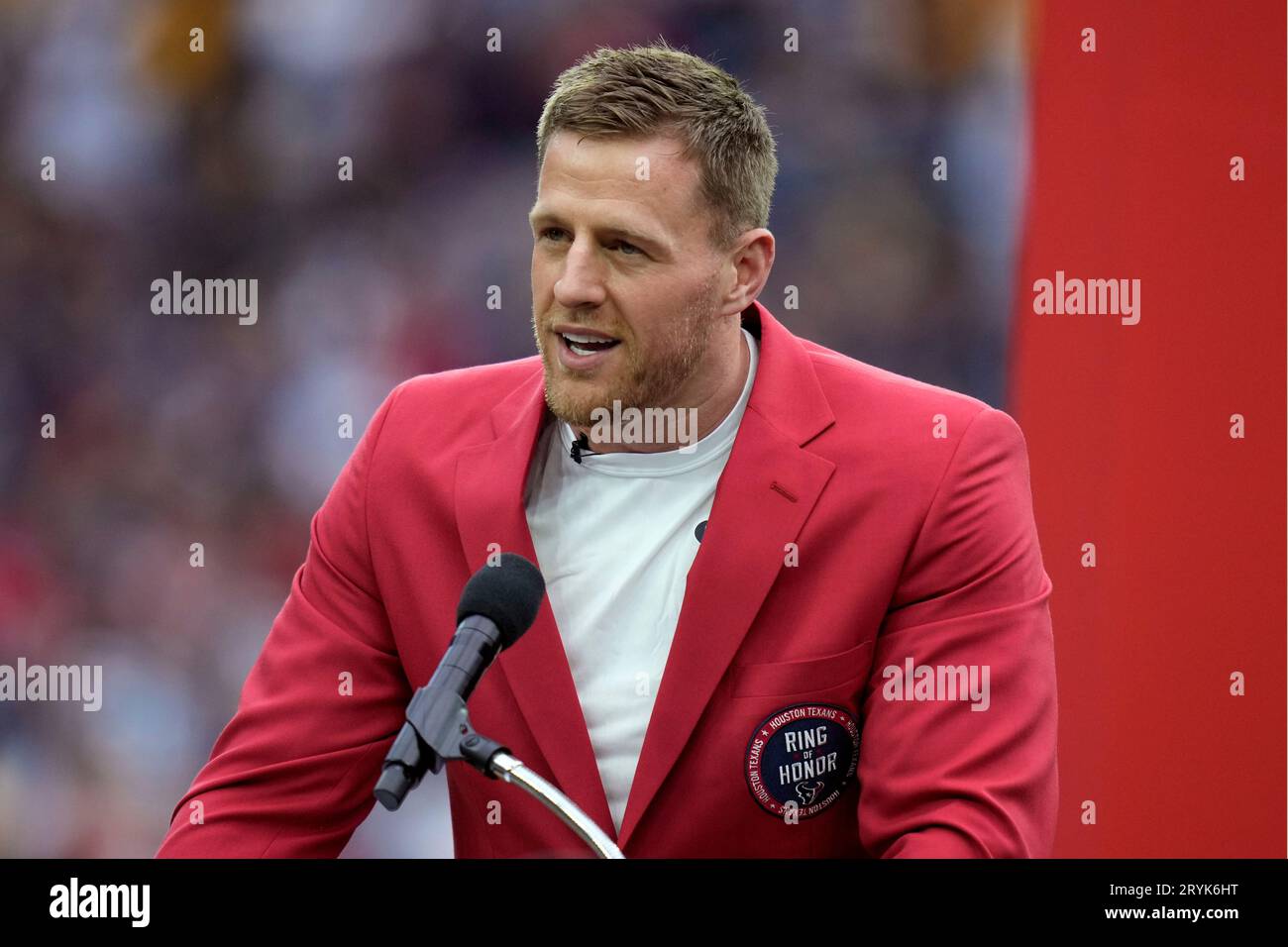 Former Houston Texans player J.J. Watt speaks during a ceremony to retire his jersey number an NFL football game between the Houston Texans and the Pittsburgh Steelers, Sunday, Oct. 1, 2023, in