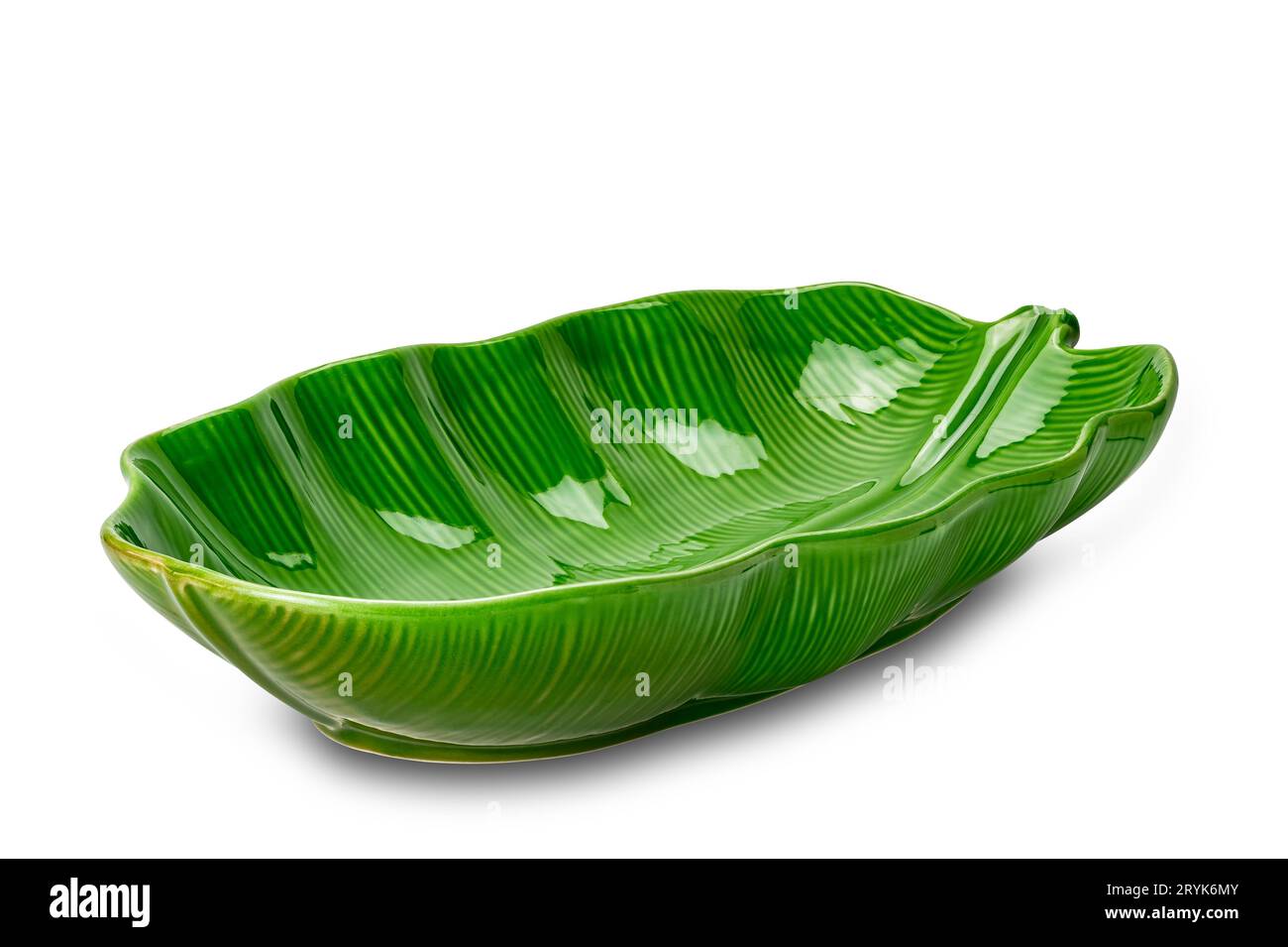 Empty beautiful green leaf shape ceramic bowl isolated on white background. Stock Photo