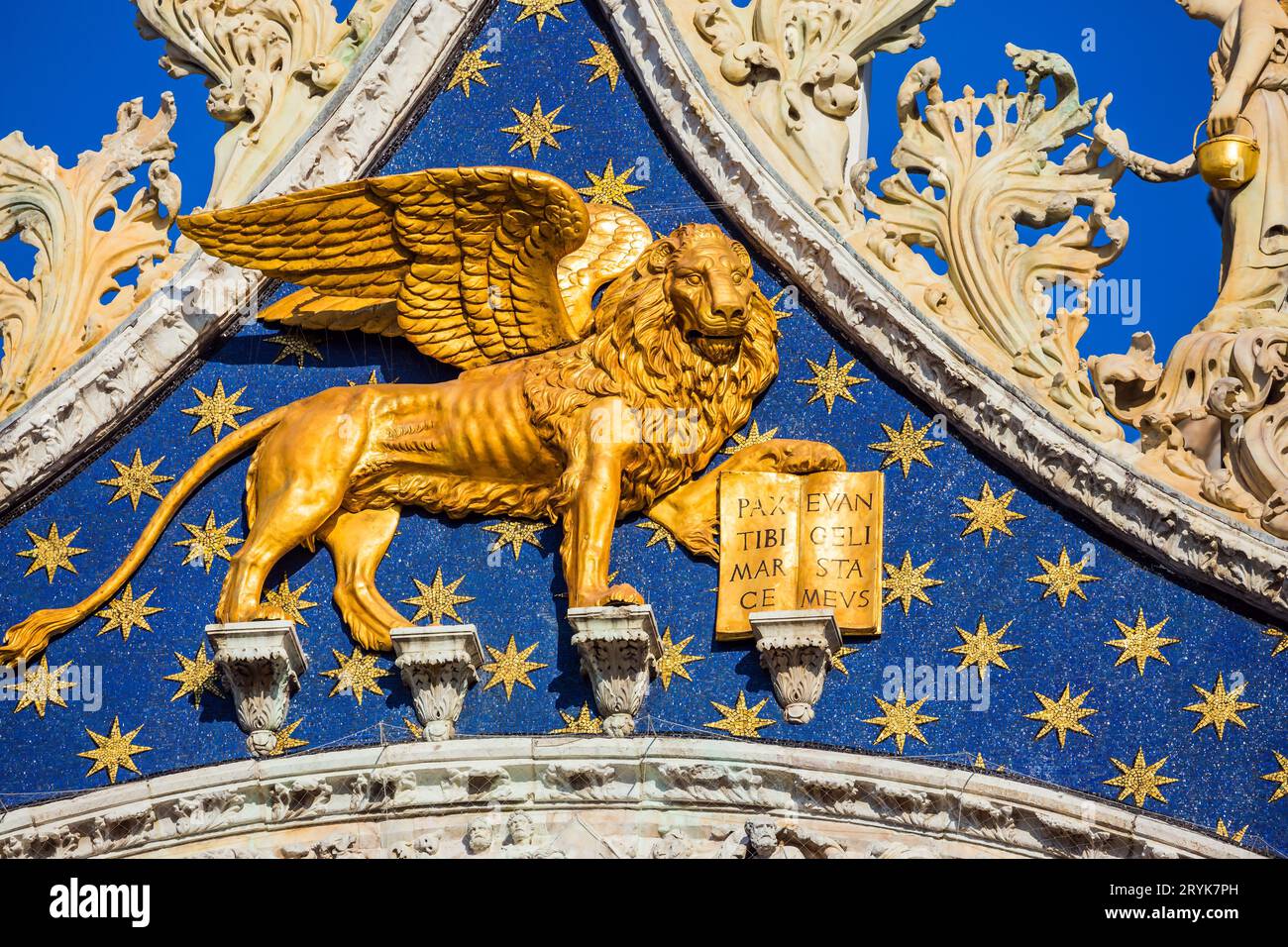 The pediment is decorated with a golden lion Stock Photo