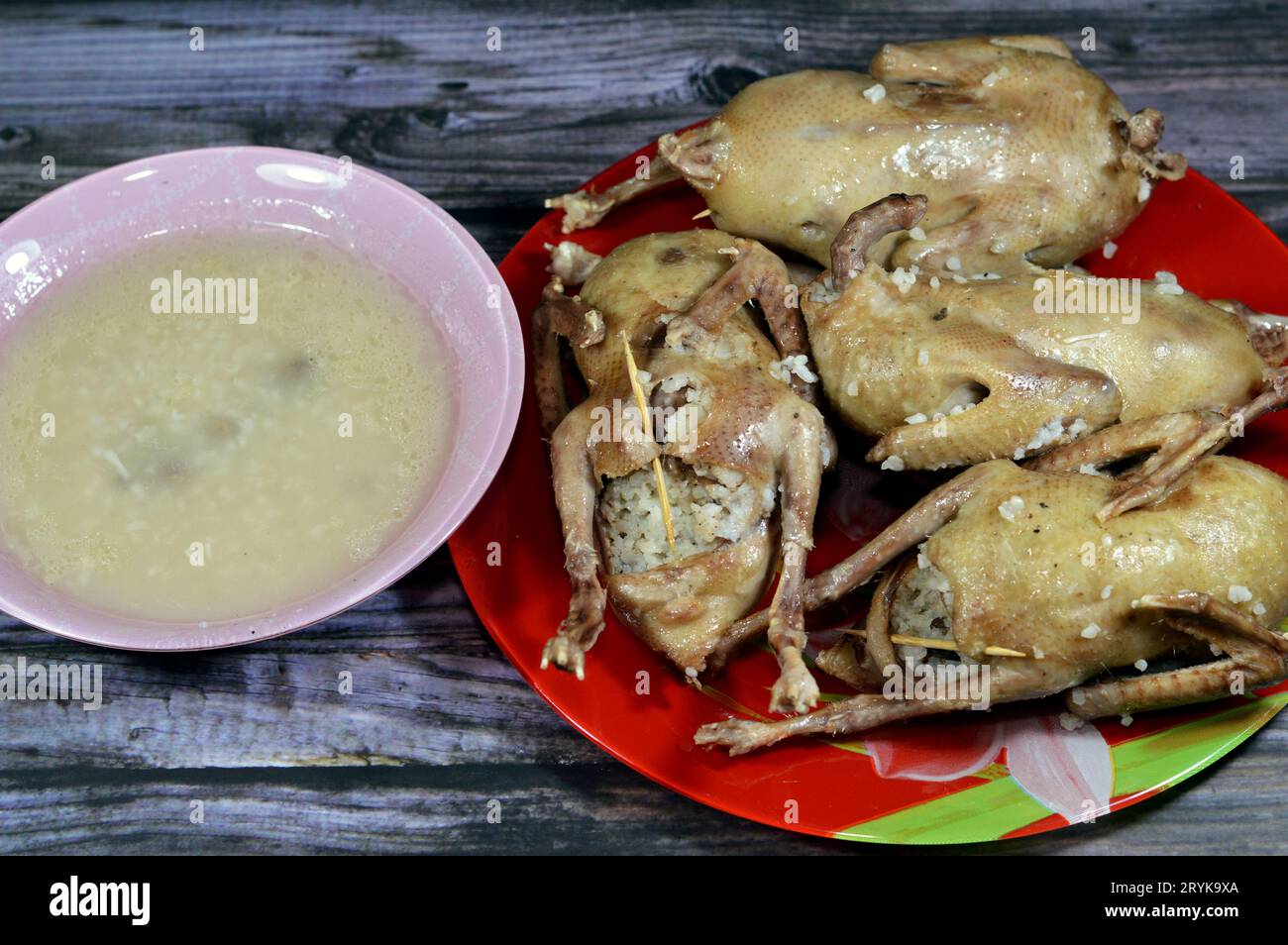 Boiled white rice stuffed pigeons or Hamam mahshi and its soup with