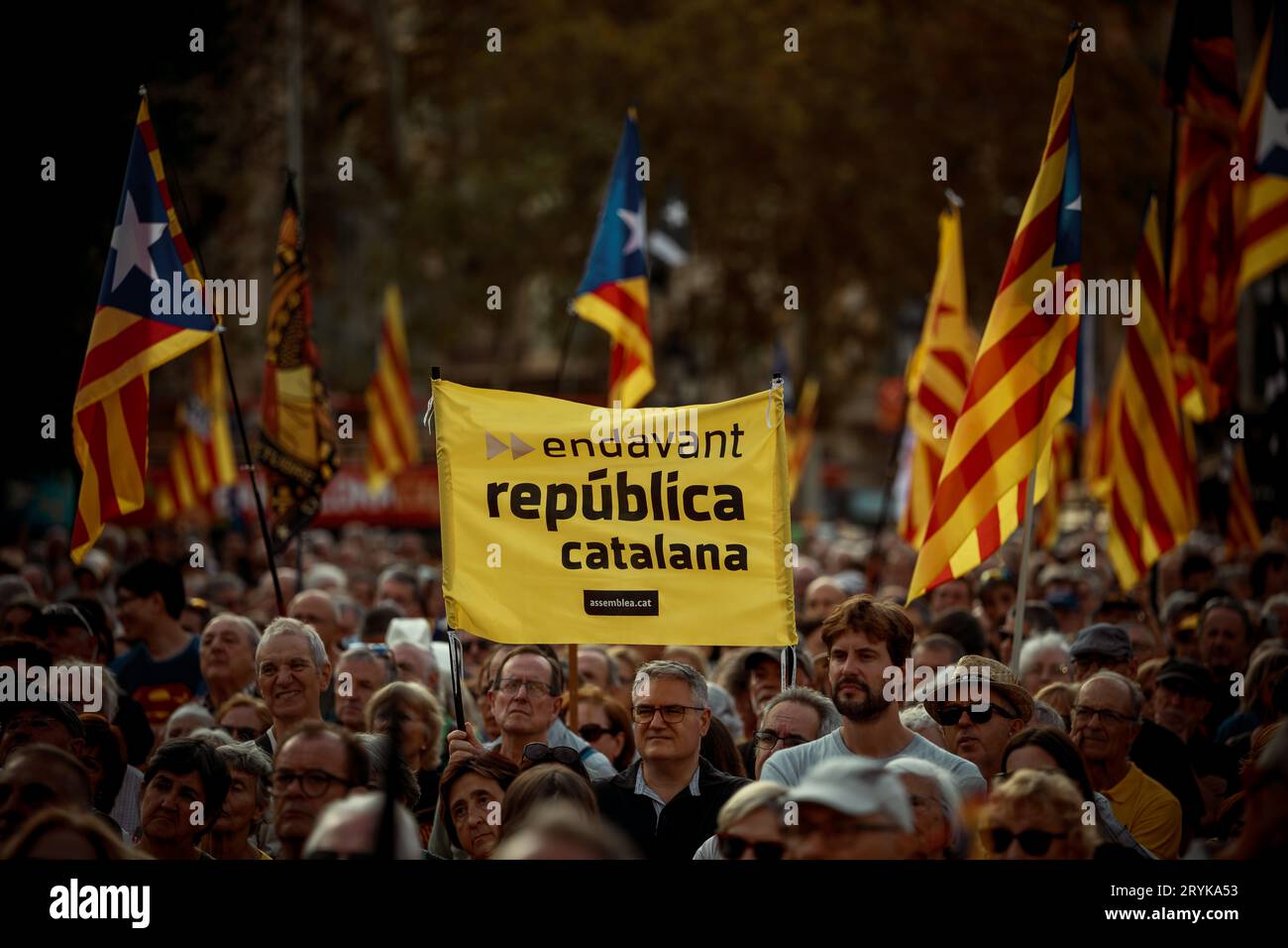 Barcelona, Spain. 1st Oct, 2023. A pro-independence activist hold a placard 'go ahead Catalan republic' during a manifestation commemorating October 1st, the date of an unauthorized referendum on Catalonia's independence in 2017. Credit: Matthias Oesterle/Alamy Live News Stock Photo