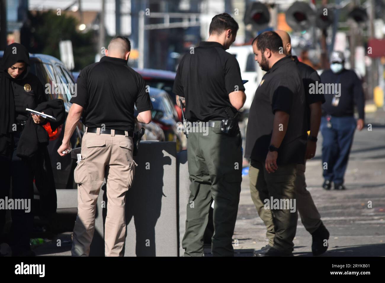 Paterson, United States. 01st Oct, 2023. Detectives converse as they